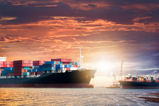 Logistics import export background of Container Cargo ship in the ocean at sunset sky, Freight Transportation