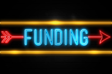 Funding  - fluorescent Neon Sign on brickwall Front view