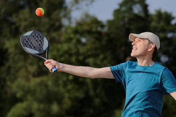 Man playing beach tennis