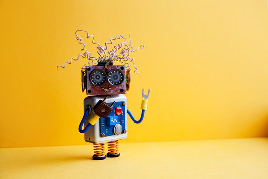 Creative design crazy robot toy, electric wires hairstyle, big eye glasses, electronic circuit blue silver body, red heart. yellow background. copy space