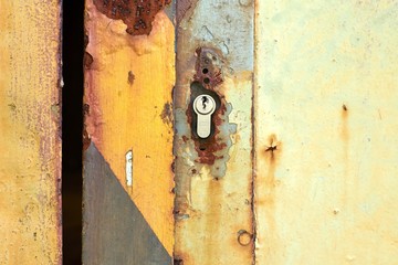 Old color with rusty metal and a new steel lock 