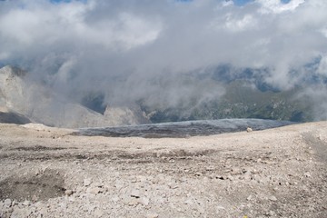 mountaineering in marmolada glacier in dolomites