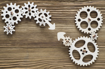 Gear wheels on wooden background. The concept of creative, logical thinking. Logic background. 