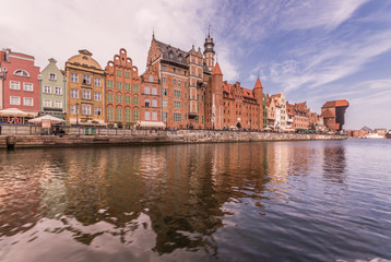 Naklejka premium Medieval waterfront reflecting in river, Gdansk, Poland