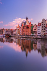 Medieval waterfront reflecting in river, Gdansk, Poland