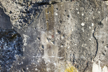 Traces of bullets on an old concrete wall background texture