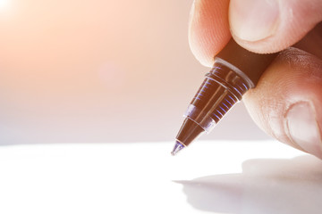 Write with a ballpoint pen
