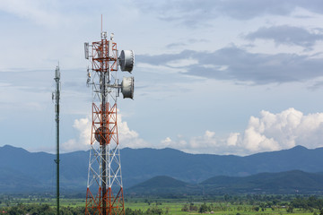 Telephone tower, communication antenna tower with the blue sky and clouds.