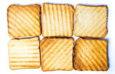 Toasted bread slices on white background