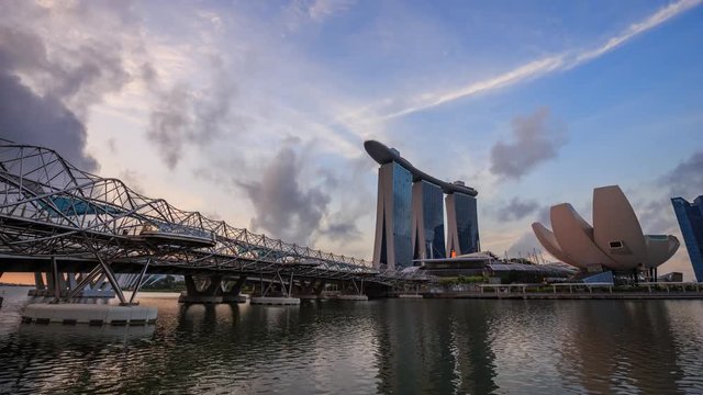 4k night to day Time-lapse of view of cityscape of Singapore city at sunrise