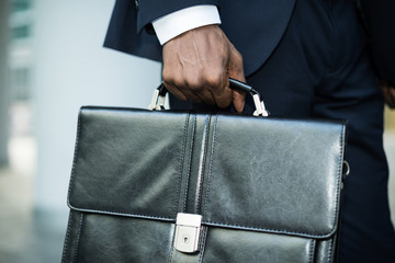 Businessman holding his briefcase