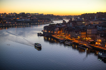 Douro river and Ribeira from Dom Luis I bridge at night time, Porto, Portugal.