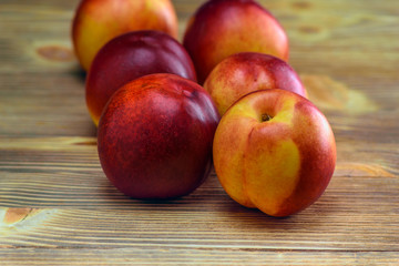 Fototapeta na wymiar peaches on a wooden background