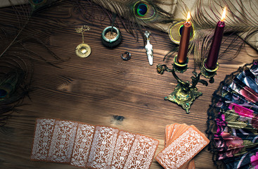 Tarot cards on wooden table. Fortune teller.