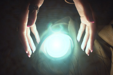 Crystal ball and fortune teller hands. Divination. Seance.