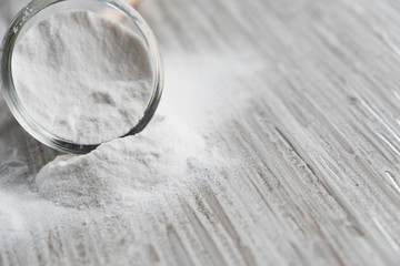 Glass bowl of baking soda. Spoonful of bicarbonate. Baking soda, Sodium bicarbonate, NaHCO3