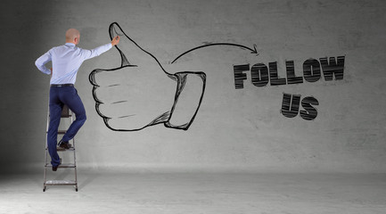 Businessman drawing thumb up sketch on a wall 3D rendering