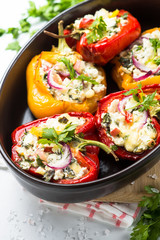 Stuffed paprika peppers with cheese and herbs.