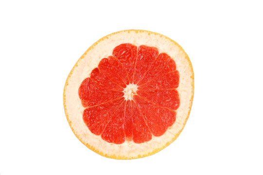 Cross section of red grapefruit slice isolated on white background