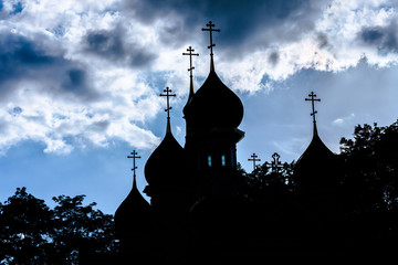Silhouette of the domes of an Orthodox temple against the sky