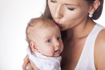 Proud mom holding in her arms a newborn.