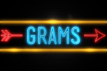 Grams  - fluorescent Neon Sign on brickwall Front view