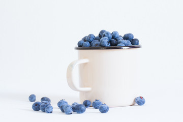 blueberries in cup isolated on white background