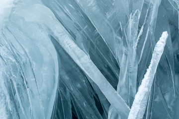 Blue icicles in a crevasse on a glacier