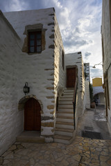Old traditional buildings in Skala village on Patmos island in Greece.
