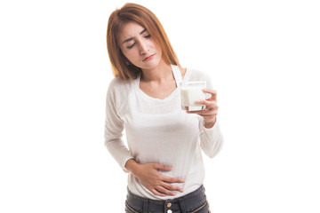 Asian woman drinking a glass of milk got stomachache.