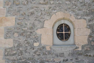 stones wall with small window