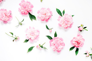 Flower pattern of pink peony flowers, branches, leaves and petals on white background. Flat lay, top view. Peony flower texture.