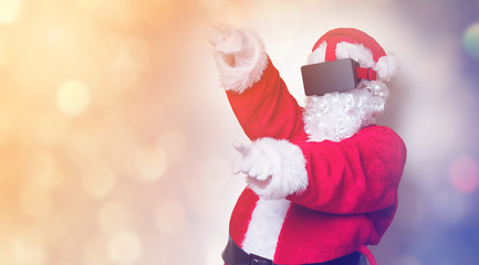 Funny Santa Claus have a joy with VR glasses