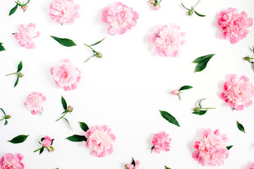 Frame of pink peony flowers, branches, leaves and petals with space for text on white background. Flat lay, top view. Peony flower texture. © Floral Deco