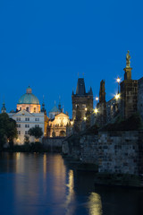 Fototapeta na wymiar Francis of Assisi church along with Charles Bridge in Prague