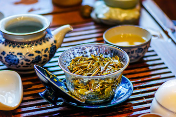Cup with brewed tea on the table