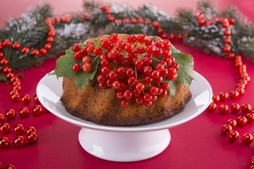 Christmas pudding with a viburnum on a festive table