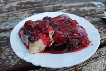 Traditional Slovenian dessert Štruklji. Steamed cottage cheese roulade. Tasty dessert on white...