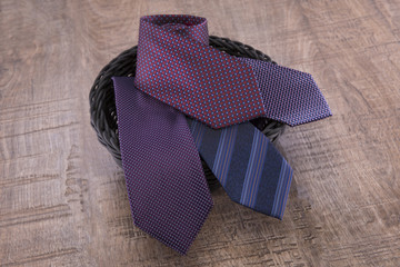 Silk ties collapsed on a wooden background