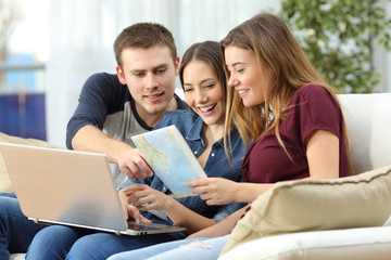 Three friends planning travel at home