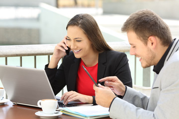 Two executives calling and working together