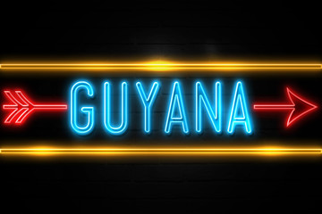 Fototapeta premium Guyana - fluorescent Neon Sign on brickwall Front view