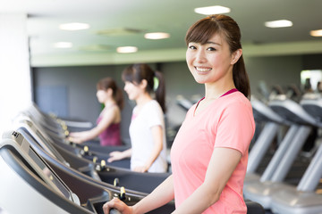 sporty asian women exercising in sports gym