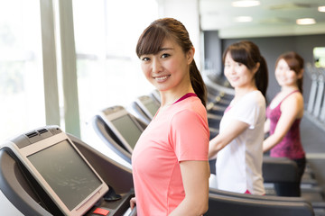 sporty asian women exercising in sports gym