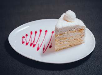 Dessert with cream on the wihte plate