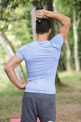 man stretching outdoorsbefore jogging