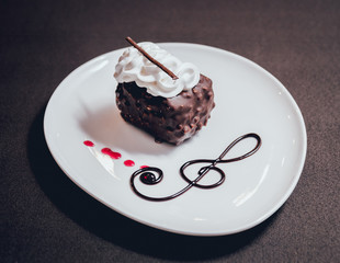 Dessert with cream on the wihte plate