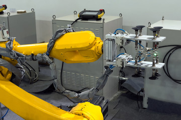 Fototapeta premium Manufacturing production industrial machine , factory robot arm in smart factory and industry 4.0 concept.