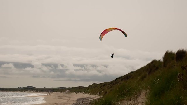 Para-glider soars dunes