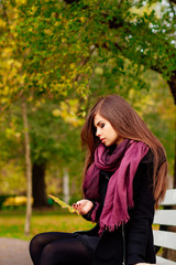 young girl in the park in autumn, october